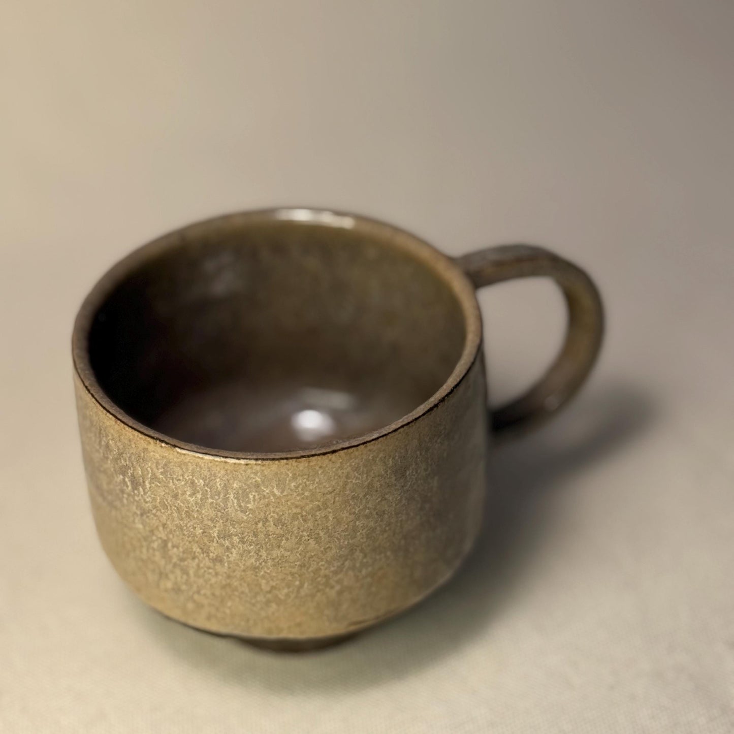 Handmade Stoneware Coffee Mug: Rustic Ceramic Pottery, Eclipse Eye Design